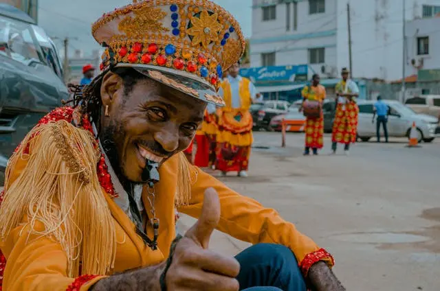 Happy person in Luanda giving a thumbs-up, expressing pride and joy