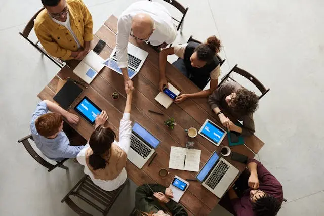Group of people in a meeting, discussing community projects